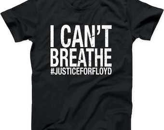 May include: Black t-shirt with white text that reads "I Can't Breathe" and "#JusticeForFloyd".