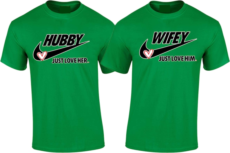 May include: Two green t-shirts with a black Nike swoosh and a red heart. The left shirt says "Hubby Just Love Her." The right shirt says "Wifey Just Love Him."
