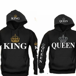 May include: Two black hoodies with white text and gold or silver crowns. One says "KING" with a gold crown, the other says "QUEEN" with a silver crown. The word "KING" and "QUEEN" are also on the sleeves.