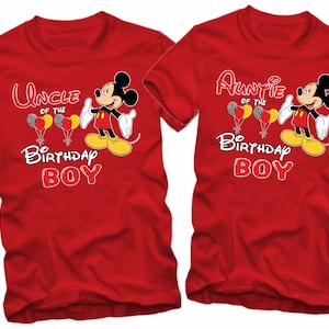 May include: Two red t-shirts with Mickey Mouse graphics. The left shirt says "Uncle of the Birthday Boy" and the right shirt says "Auntie of the Birthday Boy".