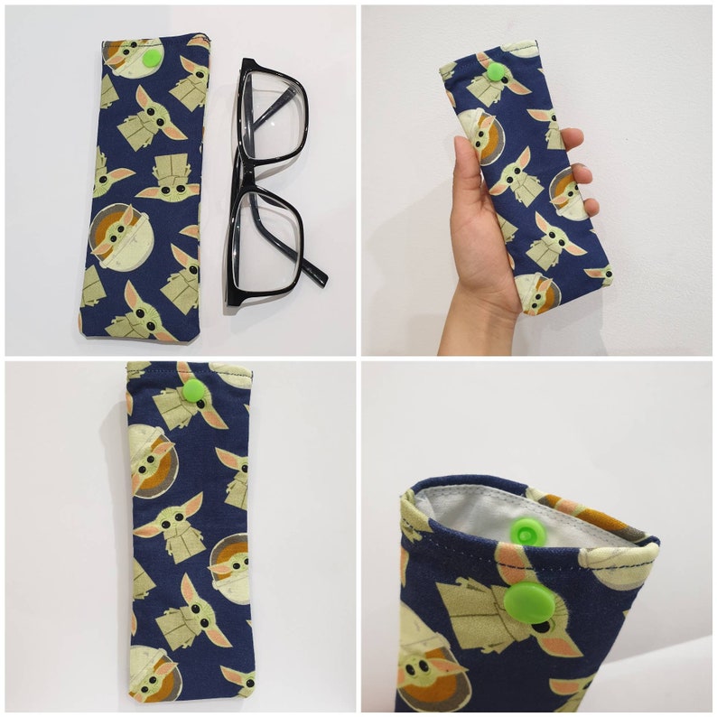 May include: A set of four blue and green fabric eyeglass cases with a repeating pattern of a cartoon character. Each case has a green button closure.