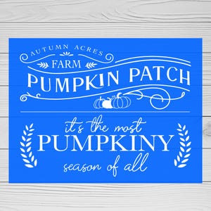 May include: A blue wooden sign with white text that reads "AUTUMN ACRES FARM PUMPKIN PATCH" and "it's the most PUMPKINY season of all." The sign features pumpkin and leaf illustrations.