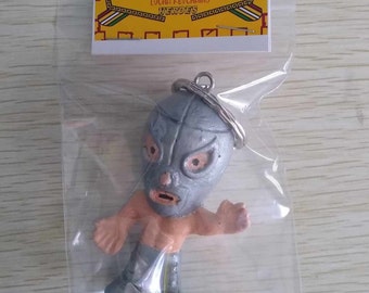 Cabezón Santo action figure keychain