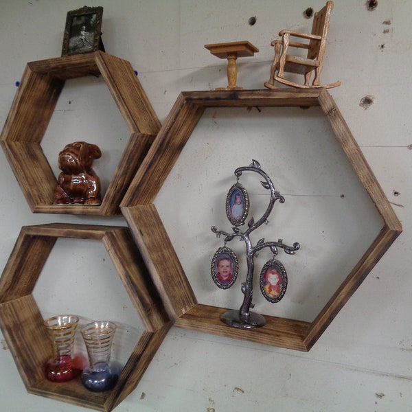 Hexagon Honeycomb Set of Three Shelve set plus one floating shelf. Made of Distressed Reclaimed Western Red Cedar, sanded & Toasted.