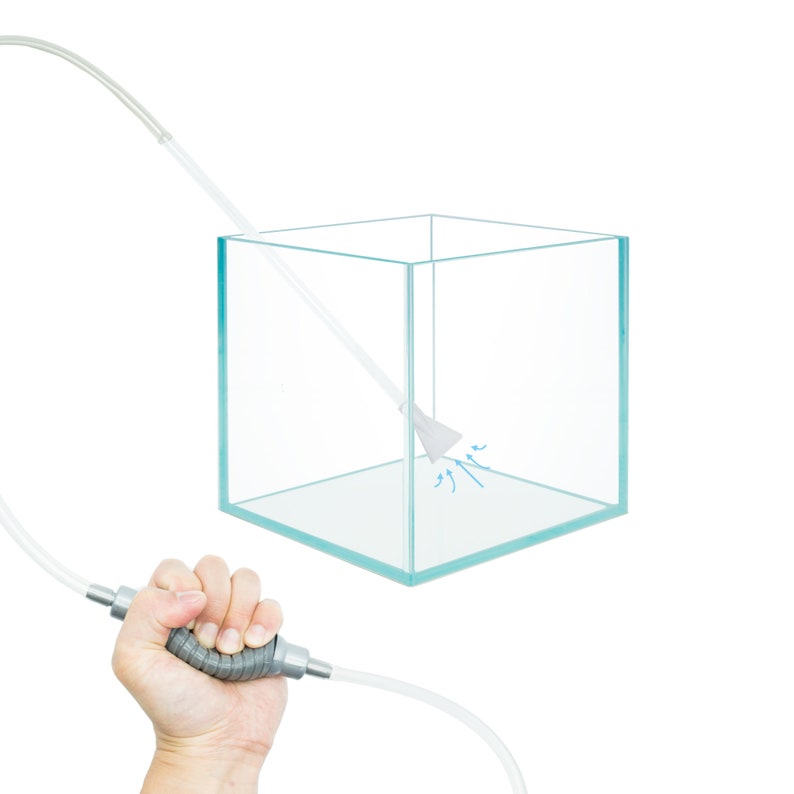 May include: A clear glass aquarium with a gray siphon tube and a white nozzle. The tube is connected to a gray handle and a clear hose. The nozzle is inside the aquarium and water is being sucked out of the aquarium.