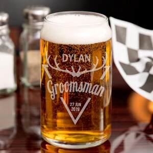 May include: A personalised glass beer can with the text "Dylan Groomman 27 JUN 2019" and a graphic of antlers.