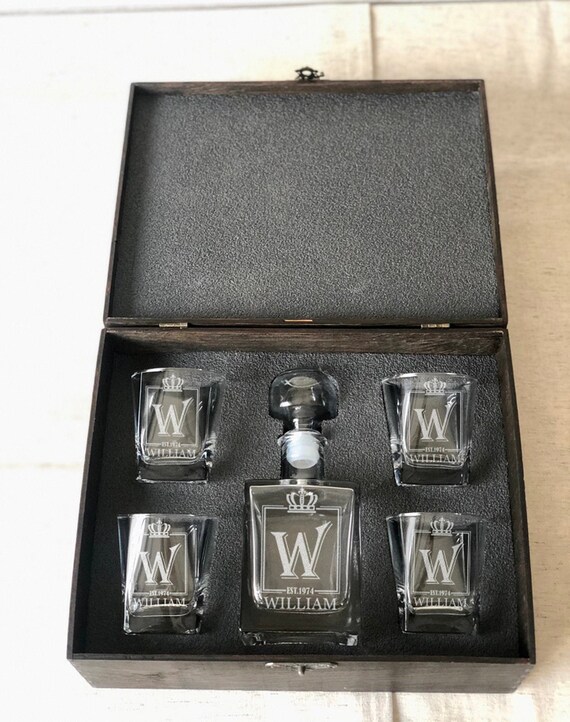 A full engraved whiskey decanter + glasses set presented in a wooden keepsake box — the kind of gift that actually stays on a bar cart forever.