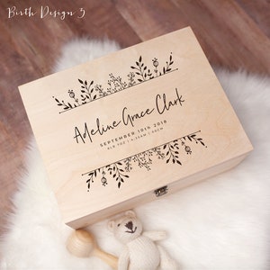 May include: A light wood keepsake box with a floral design and the inscription "Adeline Grace Clark, September 10th 2018, 6lb 7oz | 4:35AM | 50cm".