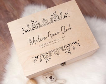 May include: A light wood keepsake box with a floral design and the inscription "Adeline Grace Clark, September 10th 2018, 6lb 7oz | 4:35AM | 50CM".