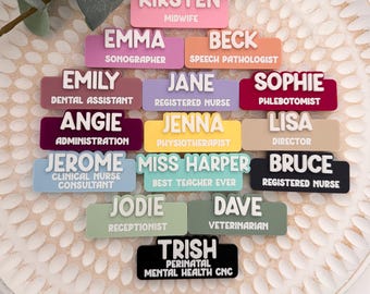 May include: A collection of rectangular name badges in various pastel and bold colors, each featuring a white raised name and a professional job title printed in white. The badges include names like Kirsten, Emma, Beck, Emily, Jane, Sophie, Angie, Jenna, Lisa, Jerome, Miss Harper, Bruce, Jodie, Dave, and Trish.