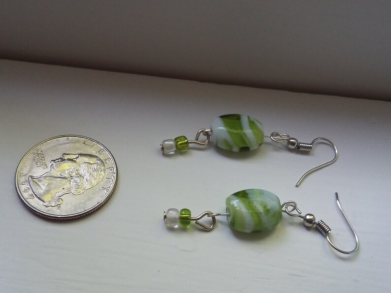 Green and white glass dangle earrings