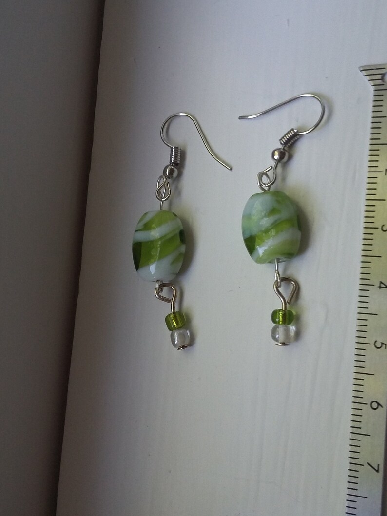 Green and white glass dangle earrings