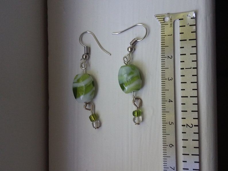 Green and white glass dangle earrings