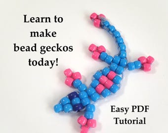 May include: A beaded gecko in blue and pink, with the text "Learn to make bead geckos today!" and "Easy PDF Tutorial". The gecko is made of small, colorful beads, with a blue body and pink accents.
