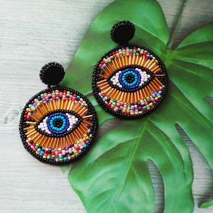 Beaded eye earrings best sale