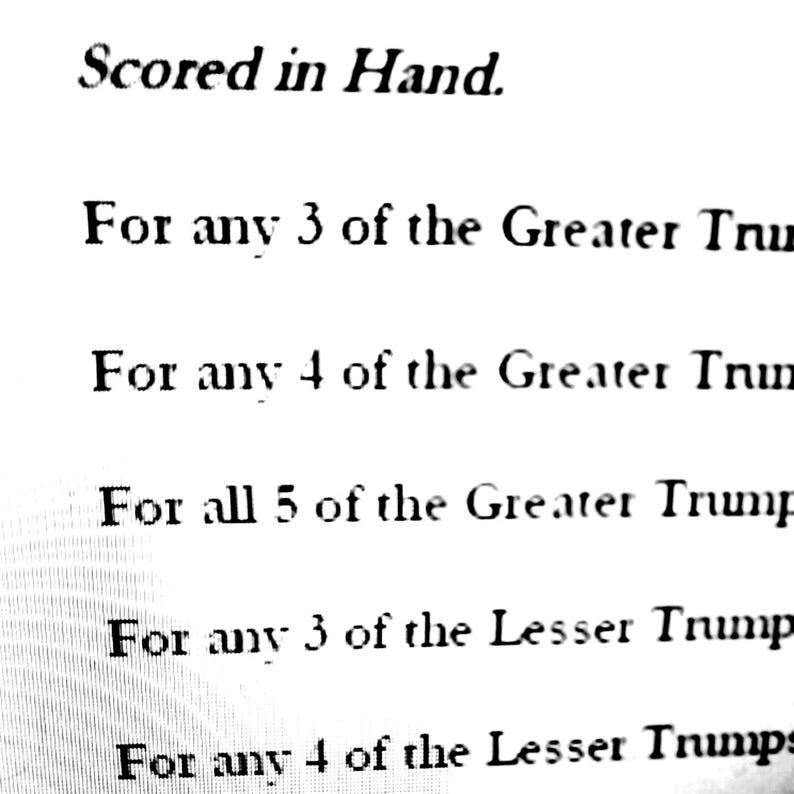 May include: Text on a white background reads "Scored in Hand." Below, it lists conditions for "Greater Trump" and "Lesser Trump" cards, specifying quantities like "For any 3" and "For all 5."