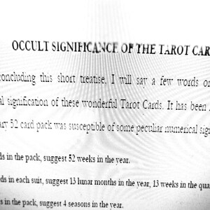 May include: A printed page with the title "OCCULT SIGNIFICANCE OF THE TAROT CARDS." The text discusses the symbolism of tarot cards, including the significance of 52 cards, 13 cards per suit, and 4 suits.