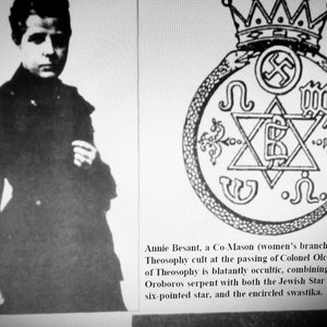 May include: Monochrome image showing a woman's portrait and a complex emblem. The emblem incorporates a crown, a swastika, a six-pointed star, and various symbols. The image text refers to Annie Besant and the Theosophy movement.
