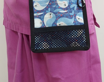 May include: A black and blue fabric utility belt with a zippered pouch and a mesh pocket. The pouch has a blue and white pattern of seals and bubbles.