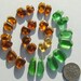 Bright green and genuine golden amber pierced fragments, for jewelry work