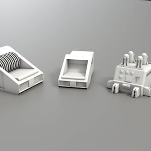 May include: A set of five white plastic model pieces for a miniature spaceship or other model. The pieces include a small cylindrical piece with two small domes on top, a larger piece with a rectangular base and a curved top, a rectangular piece with a small opening, a piece with a rectangular base and four small towers, and a piece with a rectangular base and three small towers.