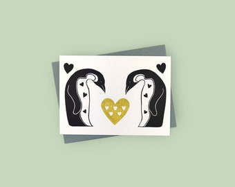 Handprinted linocut penguins in love card