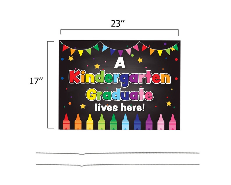May include: A black chalkboard sign with the text "A Kindergarten Graduate lives here!" in colorful letters. The sign is decorated with colorful crayons, stars, and a string of flags.