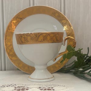 Fine Porcelain White & Gold Encrusted Demitasse Cup and Saucer