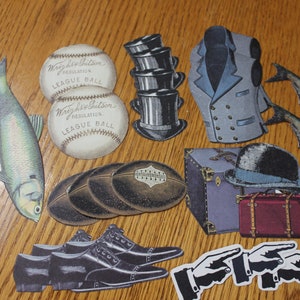May include: A collection of vintage paper cutouts, including two baseballs with the text "Wright & Ditson Regulation League Ball", two fish, a stack of hats, a jacket, a suitcase, a bowler hat, a football, a pair of shoes, and two pointing hands.