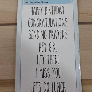 May include: A set of 8 rubber stamps with various phrases, including "Happy Birthday", "Congratulations", "Sending Prayers", "Hey Girl", "Hey There", "I Miss You", and "Let's Do Lunch". The stamps are white with black lettering and are packaged on a white card with the brand name "Clingables" and the product name "The Skinny".
