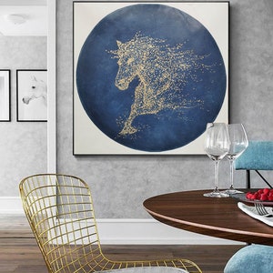 May include: A gold horse silhouette on a blue circular background. The horse is made of small gold dots and is running. The background is a dark blue with a textured look.
