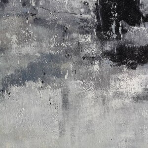 May include: Abstract painting with a textured, layered look. The painting features shades of grey and black, with a white underpainting visible in some areas.
