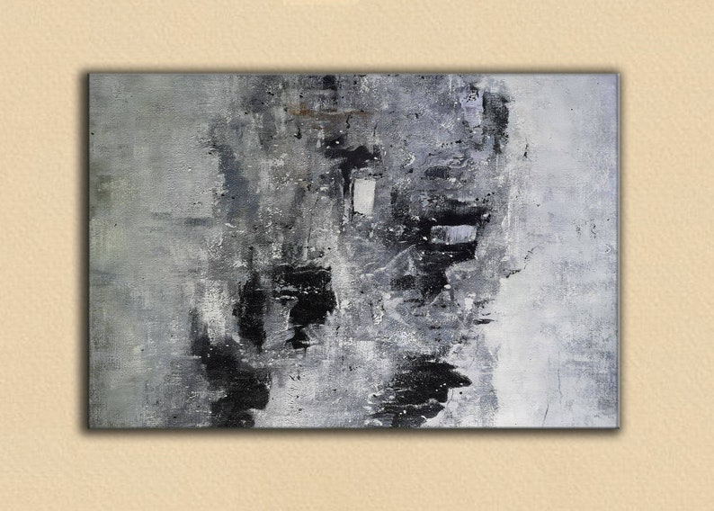 May include: Abstract painting in a grey and black colour scheme. The painting has a textured surface and a variety of brushstrokes. The colours are muted and blend together to create a sense of depth and movement.