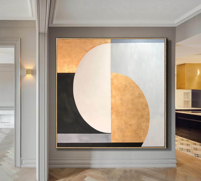 May include: Abstract geometric painting with a large white circle, gold, black, and gray shapes on a white background.