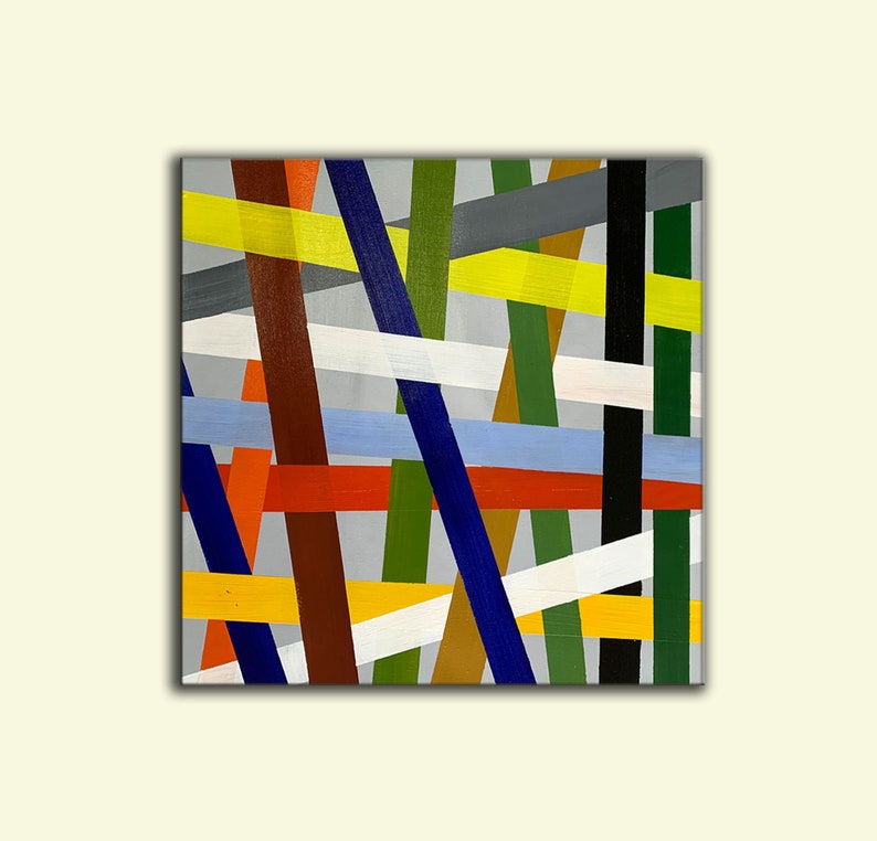 May include: Abstract painting with a geometric design of intersecting lines in various colors, including yellow, red, blue, green, brown, and white.