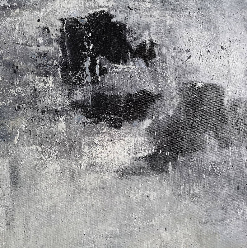 May include: Abstract painting with black and white paint strokes on a canvas. The paint is applied in a thick, textured layer, creating a sense of depth and movement.