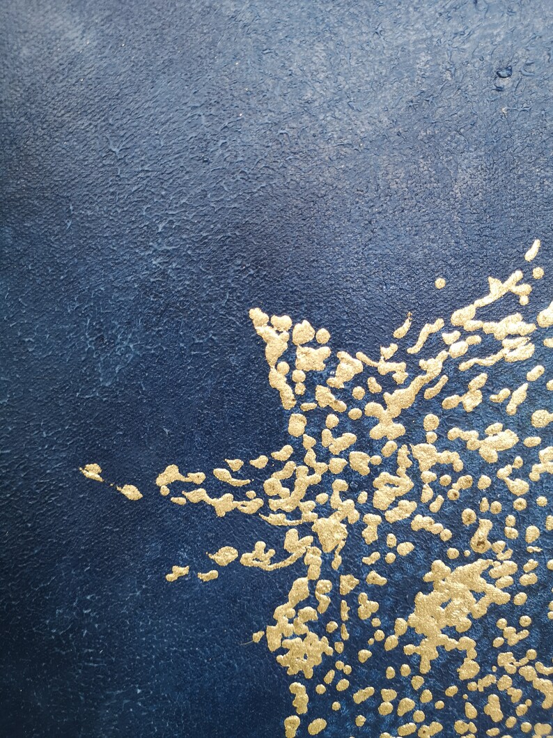 May include: Abstract art painting with a dark blue background and gold accents. The gold accents are in the shape of dots and lines, creating a textured effect.