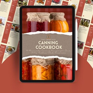 May include: A digital tablet displaying a brown and white cover with the text "The Complete Canning Cookbook: 90 Homemade Canning Recipes for Jams, Jelly, Pickles, and Preserves". The cover features a close-up of jars of preserved food, including red, orange, and yellow fruits and vegetables.