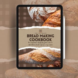 Puede incluir: Una tableta digital que muestra una portada marrón y blanca para un libro de cocina de elaboración de pan. La portada presenta el texto "The Ultimate Bread Making Cookbook" y las palabras "The comprehensive step-by-step guide on how to make delicious bread recipes for every occasion".