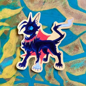 May include: A black cat sticker with a red star and a spiked collar. The cat has blue eyes and a white tail tip. The sticker is on a yellow and blue background.