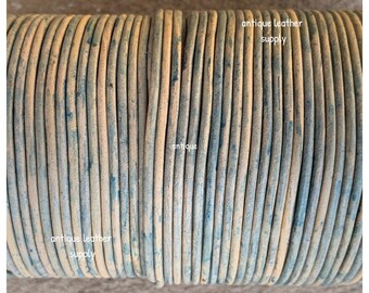 May include: Close-up of a spool of antique leather cord. The cord is a light brown color with a distressed, aged look. The text "antique leather supply" is visible on the spool.