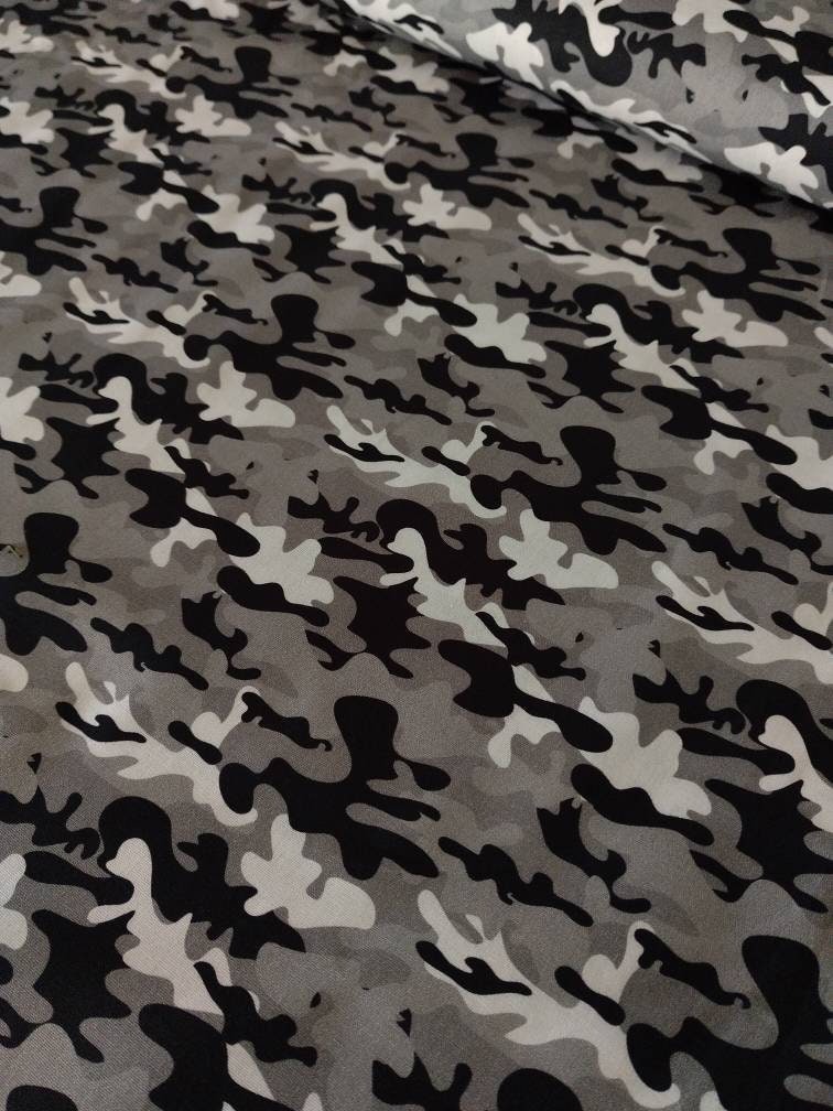 Camouflage in grey, white, black, brown, beige and green