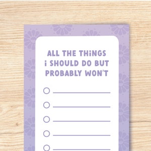 May include: A lilac notepad featuring the text "ALL THE THINGS I SHOULD DO BUT PROBABLY WON'T". The notepad has a floral border and a list of blank lines with circles for checkmarks.