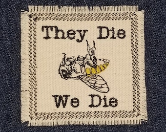 May include: A beige fabric patch with brown stitching and the text "They Die We Die" in black embroidery. A yellow and black bee illustration is centered on the patch.