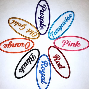 May include: Eight oval-shaped embroidered patches in different colors with the words "Purple", "Old Gold", "Orange", "Black", "Royal", "Red", "Turquoise", and "Pink" written in a cursive font.