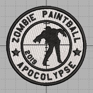 May include: White circular patch with black embroidery. The patch features a zombie silhouette in a crosshair with the text "Zombie Paintball Apocalypse 2019" around the edge.