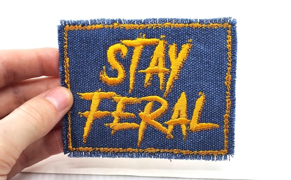 Stay Feral Embroidered Patch: Gold on Denim Canvas