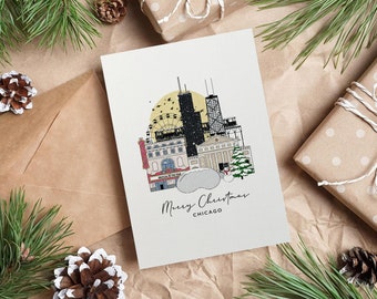 May include: A Christmas card featuring a Chicago skyline illustration with the text "Merry Christmas Chicago." The card has a cream background with a drawing of buildings, a Ferris wheel, and a Christmas tree. The card is surrounded by pine needles, pine cones, and wrapped gifts.
