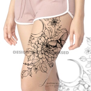 May include: Black and white line art tattoo design featuring a crescent moon, a butterfly, and a large flower with leaves. The design is on a woman's thigh.