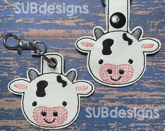 Kuh Druckknopf Design im hoop stickerei sticken keychain keyfob Schlüsselanhänger Vinyl klein groß weiß braun Spot gepunktet schwarz rosa